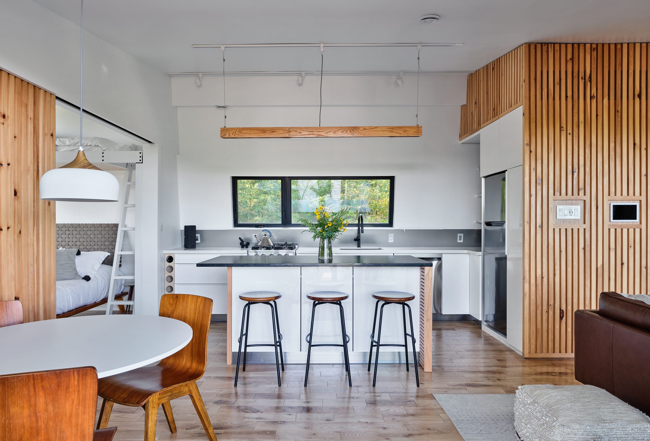 Kitchen island with bar stools and handcrafted woodwork